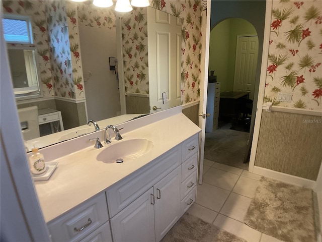 1961 Palo Duro Blvd, North Fort Myers, FL 33917 - bathroom featuring wallpapered walls, vanity, and tile patterned flooring
