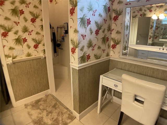 1961 Palo Duro Blvd, North Fort Myers, FL 33917 - bathroom with wallpapered walls, walk in shower, vanity, a wainscoted wall, and tile patterned floors