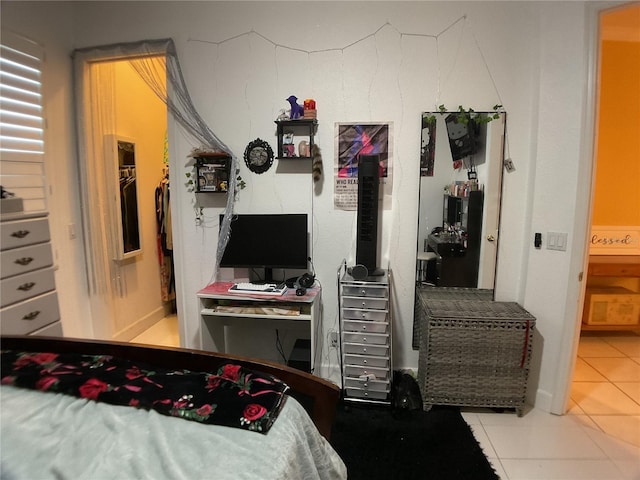 1961 Palo Duro Blvd, North Fort Myers, FL 33917 - bedroom with tile patterned flooring, an office area, and a spacious closet