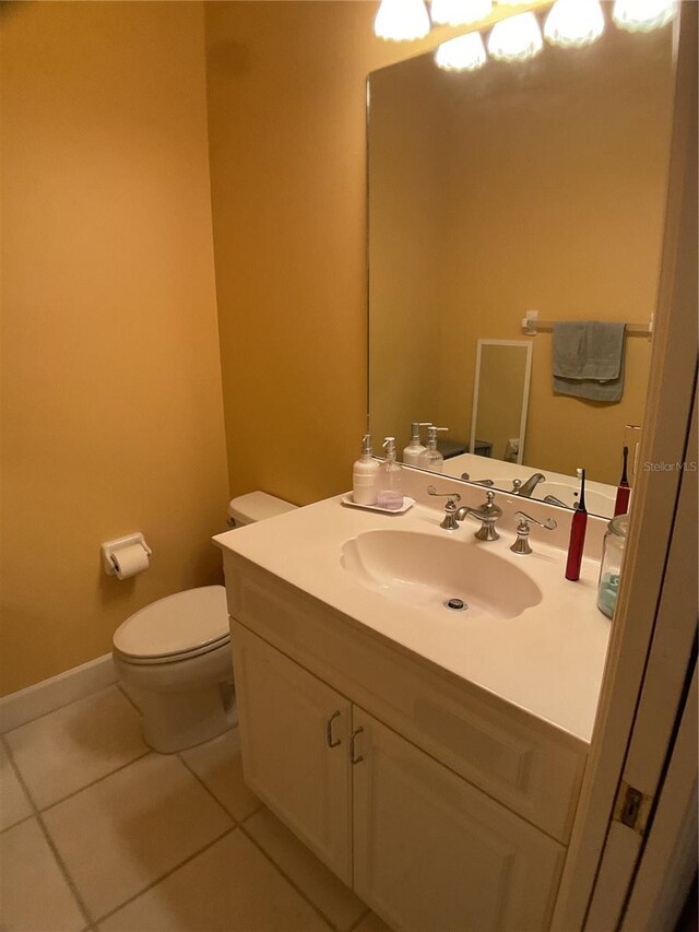 1961 Palo Duro Blvd, North Fort Myers, FL 33917 - bathroom featuring tile patterned floors, toilet, and vanity