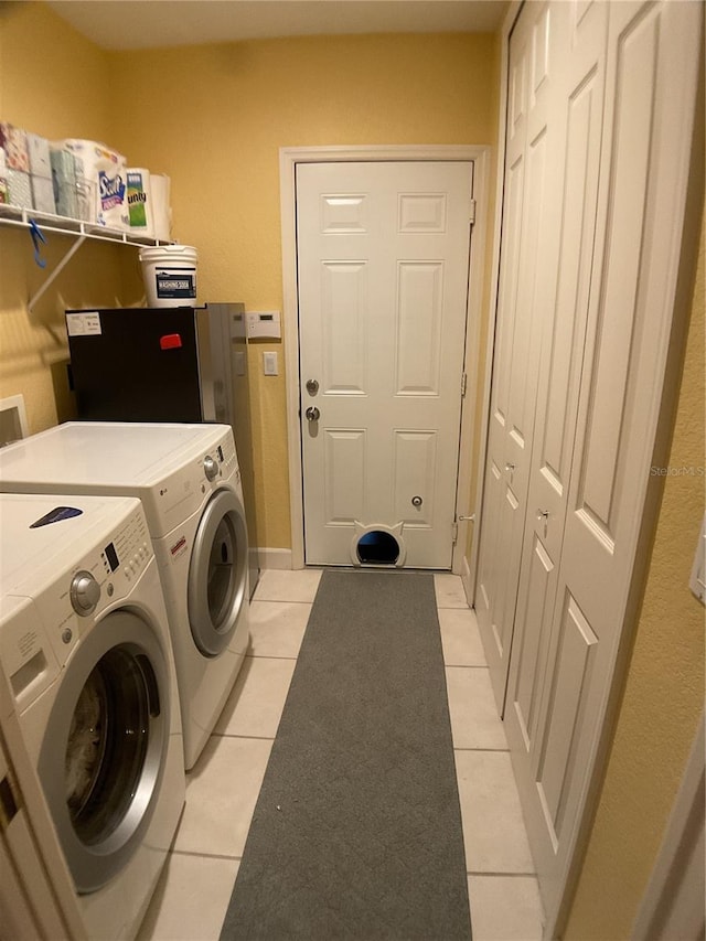 1961 Palo Duro Blvd, North Fort Myers, FL 33917 - laundry area featuring washer and dryer and light tile patterned floors