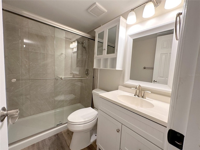4158 Tamiami Trl Unit A5, Port Charlotte, FL 33952 - full bath featuring toilet, a shower stall, vanity, and wood finished floors