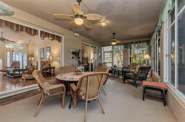24371 Folkstone Ave, Punta Gorda, FL 33980 - dining room featuring a textured ceiling and a ceiling fan
