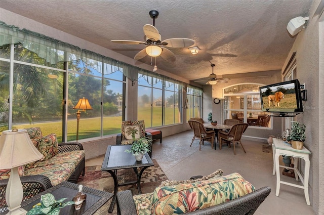 24371 Folkstone Ave, Punta Gorda, FL 33980 - sunroom featuring outdoor lounge area, ceiling fan, and outdoor dining space