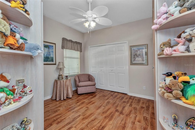 24371 Folkstone Ave, Punta Gorda, FL 33980 - sitting room with light wood finished floors, baseboards, and ceiling fan