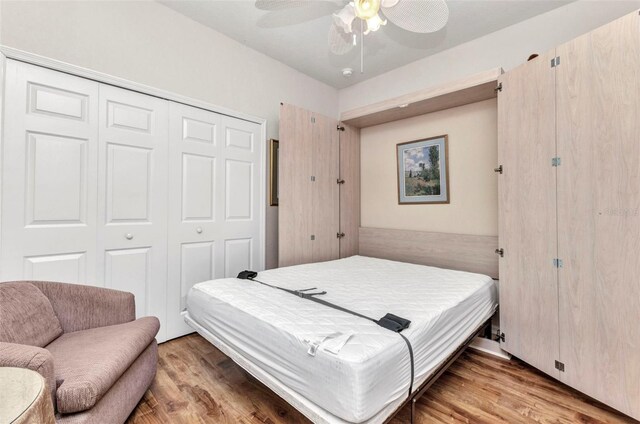 24371 Folkstone Ave, Punta Gorda, FL 33980 - bedroom with a closet, wood finished floors, and a ceiling fan