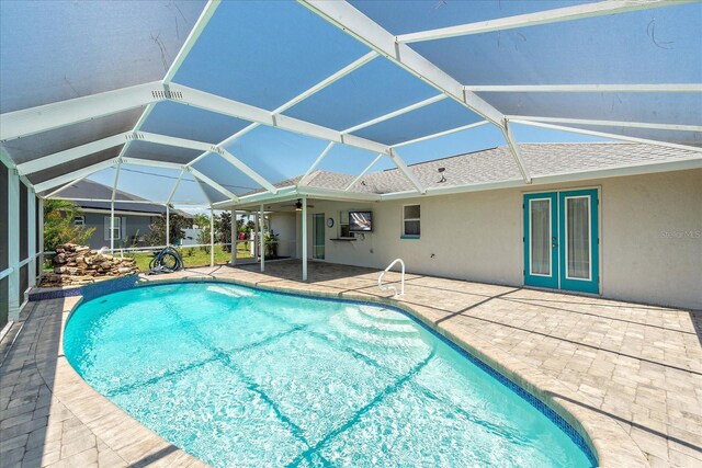 25449 Doredo Dr, Punta Gorda, FL 33955 - swimming pool featuring a patio and glass enclosure