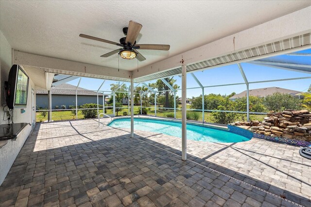 25449 Doredo Dr, Punta Gorda, FL 33955 - swimming pool featuring a patio, glass enclosure, and ceiling fan