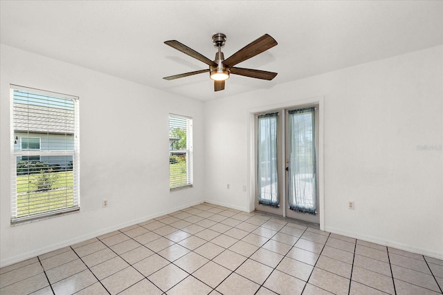 25449 Doredo Dr, Punta Gorda, FL 33955 - empty room featuring a ceiling fan, french doors, baseboards, and light tile patterned floors