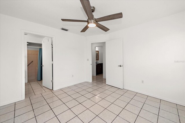25449 Doredo Dr, Punta Gorda, FL 33955 - unfurnished room with a ceiling fan, baseboards, and light tile patterned flooring