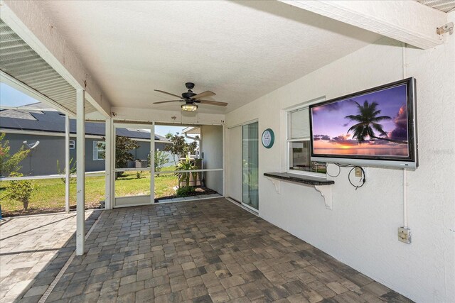 25449 Doredo Dr, Punta Gorda, FL 33955 - unfurnished sunroom featuring a ceiling fan