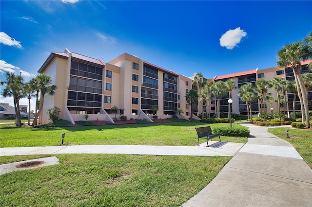 3006 Caring Way Unit 615, Port Charlotte, FL 33952 - surrounding community with a yard