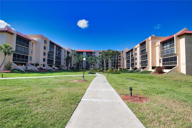 3006 Caring Way Unit 615, Port Charlotte, FL 33952 - surrounding community with a lawn