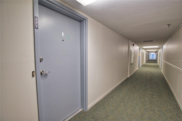 3006 Caring Way Unit 615, Port Charlotte, FL 33952 - corridor with dark colored carpet, a textured ceiling, and baseboards