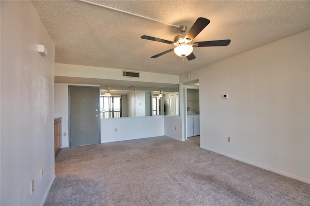 3006 Caring Way Unit 615, Port Charlotte, FL 33952 - carpeted empty room featuring ceiling fan, a textured ceiling, independent washer and dryer, and baseboards