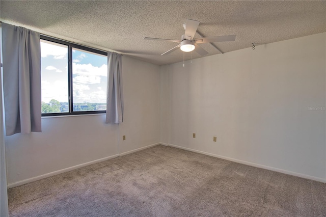 3006 Caring Way Unit 615, Port Charlotte, FL 33952 - carpeted spare room with a ceiling fan, a textured ceiling, and baseboards