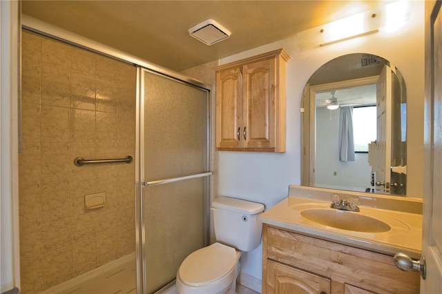 3006 Caring Way Unit 615, Port Charlotte, FL 33952 - bathroom featuring a shower stall, vanity, toilet, and a ceiling fan