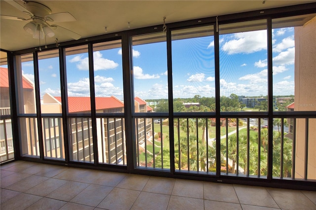 3006 Caring Way Unit 615, Port Charlotte, FL 33952 - unfurnished sunroom with tile patterned floors, healthy amount of natural light, and floor to ceiling windows