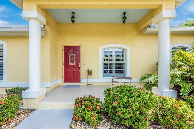 property entrance featuring stucco siding