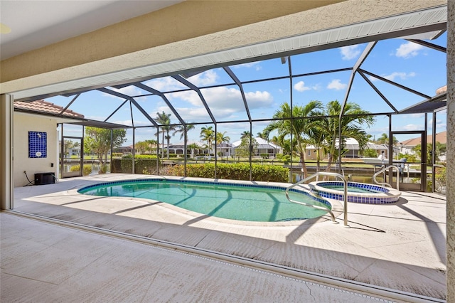 2719 Mayaguana Ct, Punta Gorda, FL 33950 - view of pool featuring a patio, a pool with connected hot tub, and a lanai