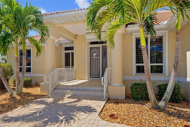 2719 Mayaguana Ct, Punta Gorda, FL 33950 - entrance to property featuring stucco siding and a tile roof