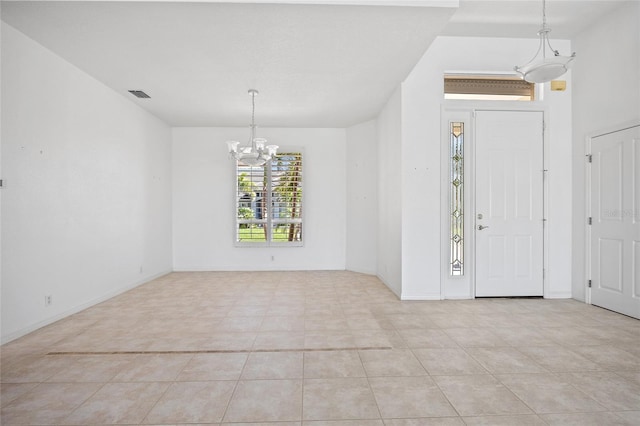 2719 Mayaguana Ct, Punta Gorda, FL 33950 - foyer featuring a chandelier, light tile patterned floors, and baseboards