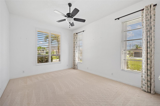 2719 Mayaguana Ct, Punta Gorda, FL 33950 - carpeted empty room with healthy amount of natural light, a ceiling fan, and baseboards
