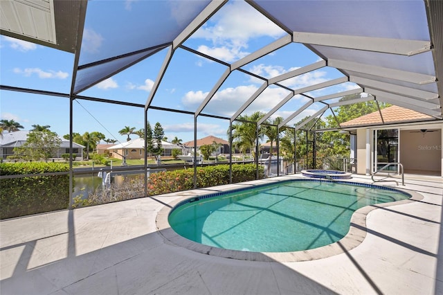2719 Mayaguana Ct, Punta Gorda, FL 33950 - view of swimming pool with a patio, a residential view, a water view, a pool with connected hot tub, and a ceiling fan
