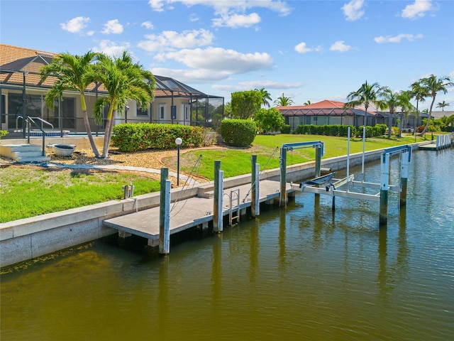 2719 Mayaguana Ct, Punta Gorda, FL 33950 - dock featuring boat lift, a water view, and a lawn