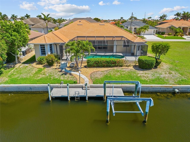 2719 Mayaguana Ct, Punta Gorda, FL 33950 - back of property featuring a tile roof, a water view, a residential view, and a lanai