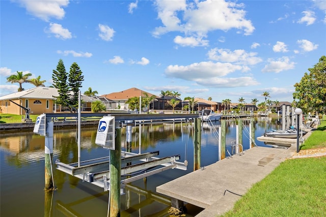 2719 Mayaguana Ct, Punta Gorda, FL 33950 - dock area with boat lift, a residential view, and a water view