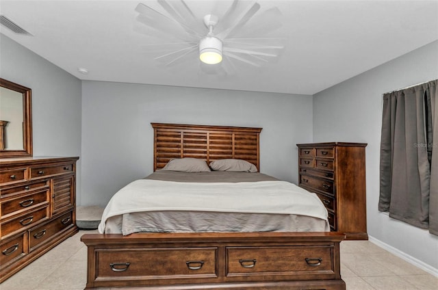 bedroom featuring light tile patterned floors, baseboards, and ceiling fan