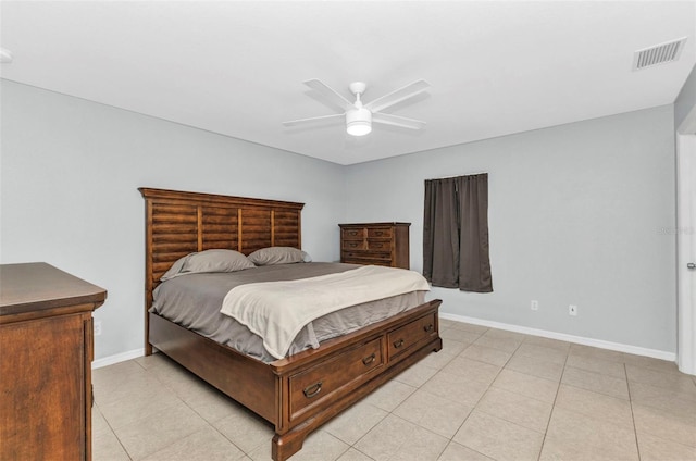 bedroom with baseboards, light tile patterned flooring, and a ceiling fan