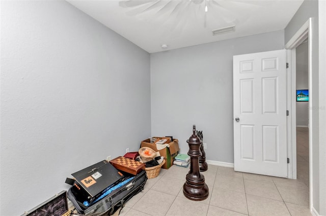 bedroom with light tile patterned floors and ceiling fan