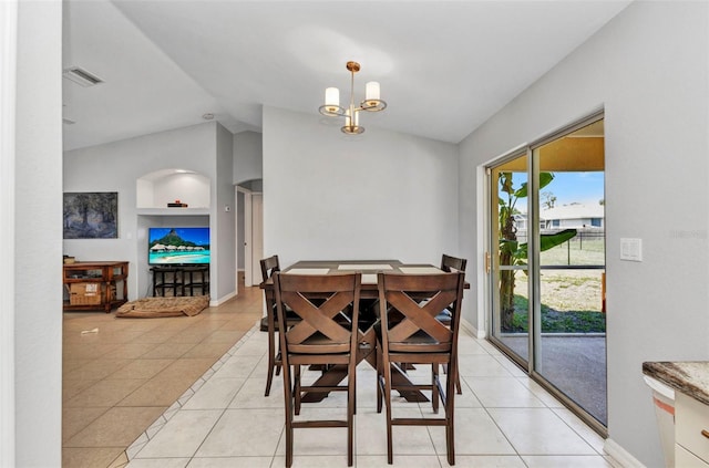dining room with built in features, lofted ceiling, light tile patterned floors, and baseboards