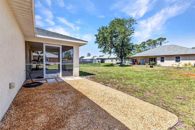view of yard with a sunroom