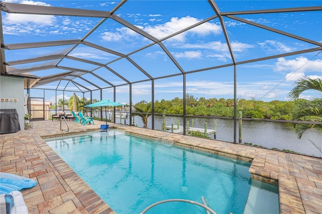 19246 Moore Haven Ct, Port Charlotte, FL 33948 - swimming pool with a patio, a water view, and glass enclosure