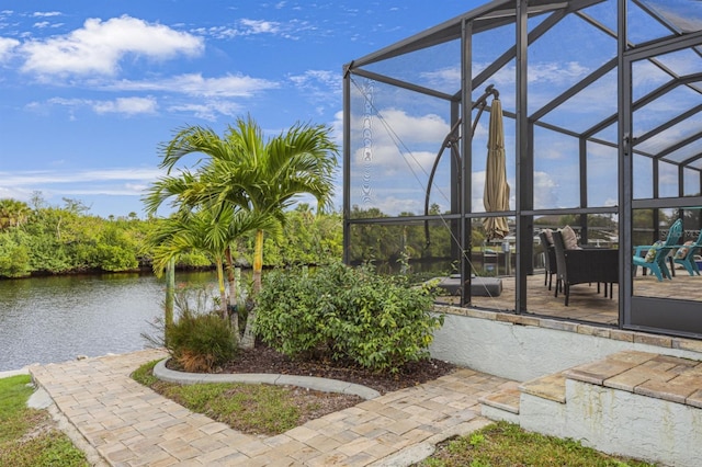 19246 Moore Haven Ct, Port Charlotte, FL 33948 - view of patio with glass enclosure and a water view