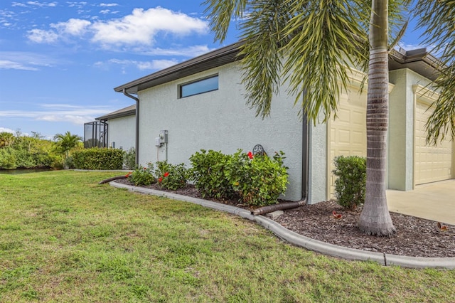 19246 Moore Haven Ct, Port Charlotte, FL 33948 - view of side of property featuring stucco siding, a garage, a lawn, and driveway