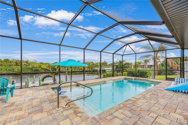 19246 Moore Haven Ct, Port Charlotte, FL 33948 - outdoor pool featuring a patio area, a water view, and glass enclosure