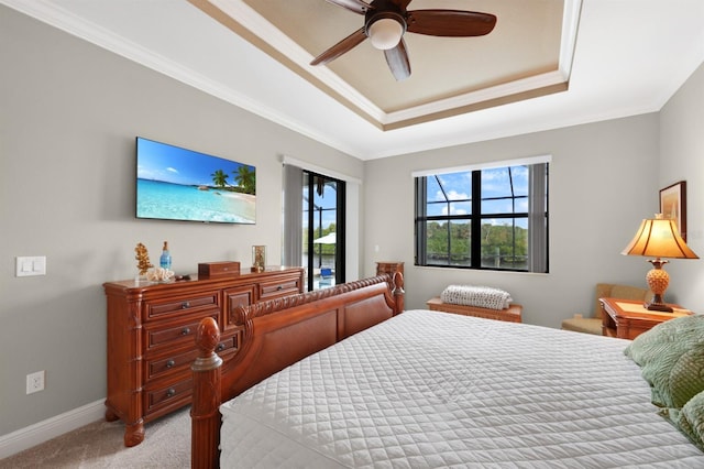 19246 Moore Haven Ct, Port Charlotte, FL 33948 - carpeted bedroom with a tray ceiling, access to exterior, baseboards, ornamental molding, and ceiling fan