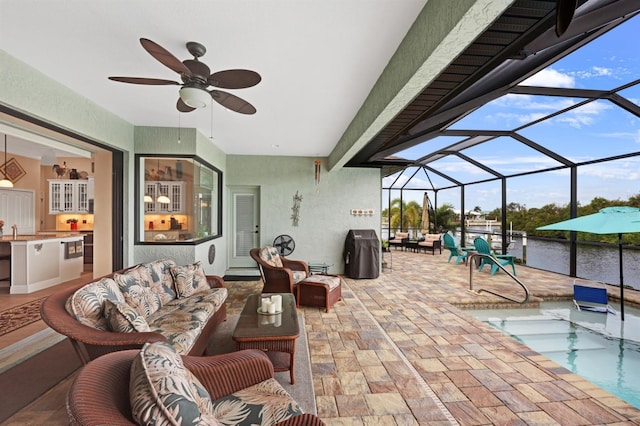 19246 Moore Haven Ct, Port Charlotte, FL 33948 - view of patio / terrace featuring outdoor lounge area, a ceiling fan, an outdoor kitchen, and a lanai