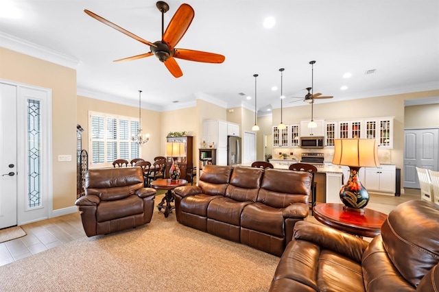19246 Moore Haven Ct, Port Charlotte, FL 33948 - living area featuring a ceiling fan, a chandelier, recessed lighting, ornamental molding, and baseboards