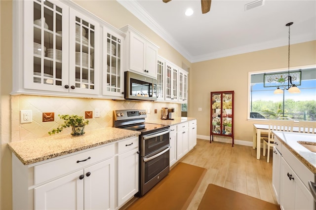 19246 Moore Haven Ct, Port Charlotte, FL 33948 - kitchen with appliances with stainless steel finishes, crown molding, backsplash, white cabinets, and glass insert cabinets