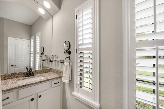 19246 Moore Haven Ct, Port Charlotte, FL 33948 - bathroom with a textured wall and vanity