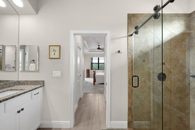 19246 Moore Haven Ct, Port Charlotte, FL 33948 - bathroom featuring ceiling fan, a shower stall, ensuite bathroom, baseboards, and vanity