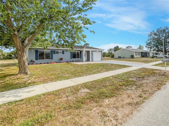 3342 Avanti Cir, North Port, FL 34287 - single story home with concrete driveway, a garage, a front yard, and stucco siding