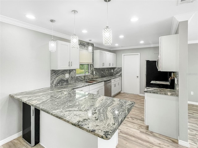 3342 Avanti Cir, North Port, FL 34287 - kitchen with stainless steel dishwasher, a sink, light stone counters, decorative backsplash, and a peninsula