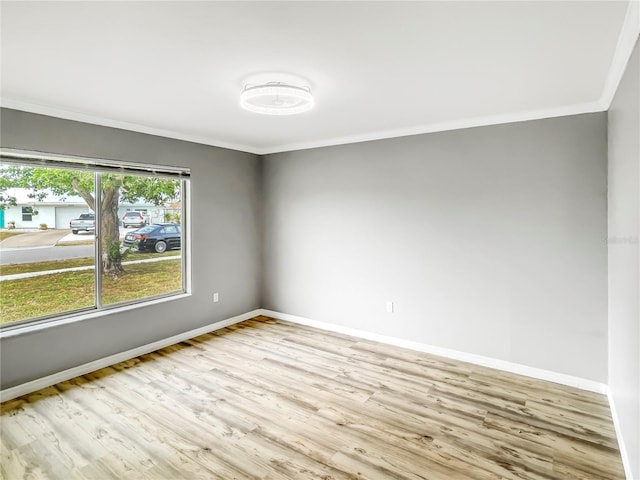 3342 Avanti Cir, North Port, FL 34287 - empty room with ornamental molding, wood finished floors, and baseboards