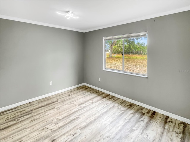 3342 Avanti Cir, North Port, FL 34287 - spare room featuring wood finished floors, baseboards, and ornamental molding